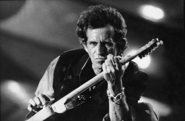 Keith Richards Playing a Guitar at a Rock Concert