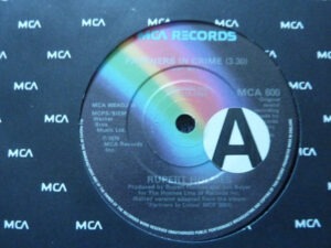 Rupert Holmes - Partners In Crime (7", Single, Promo) (Near Mint (NM or M-))